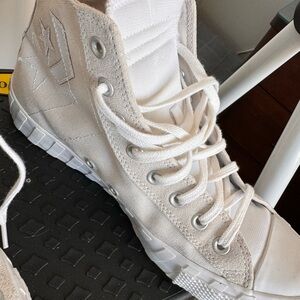 Cream canvas All Star high tops.